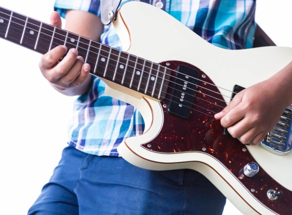 Dylan Miles plays lead guitar for The Dylan Miles Experience in Denver